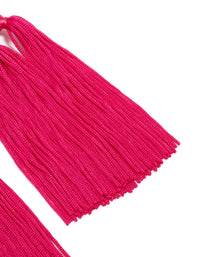 Designed with hot pink fabric, these statement drop earrings showcase beads and tassel elements close up view - link has visual effect only