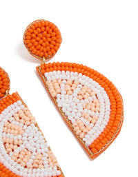 Designed with orange seed beads, these fruit drop earrings feature statement style in white, peachpuff, and gold post detail view - link has visual effect only
