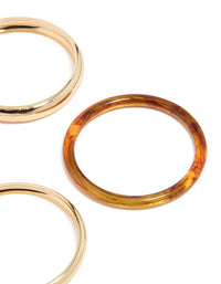 Featuring gold and mixed acrylic bangle 4-pack with hot pink band close up view - link has visual effect only