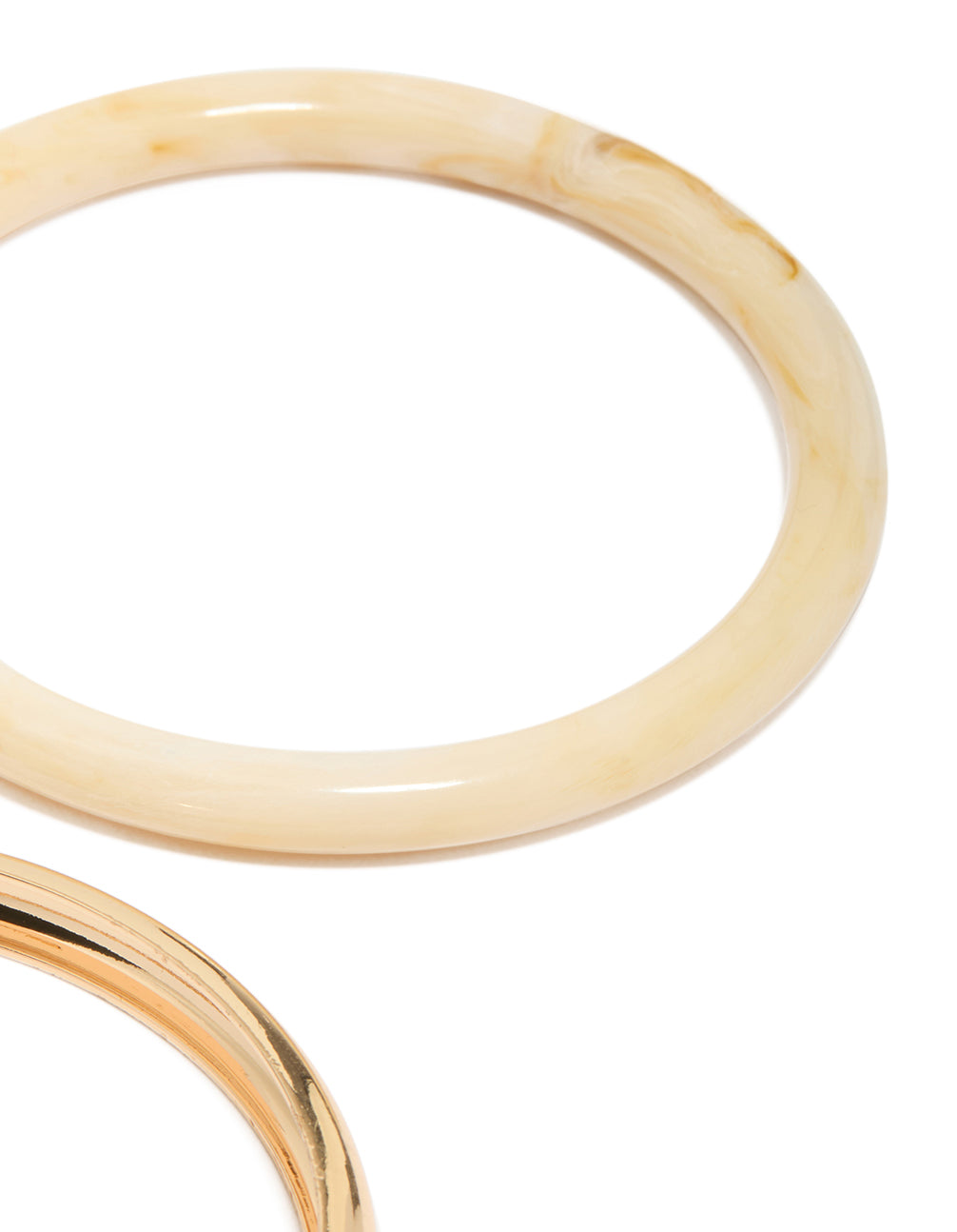 Showcasing gold and blue acrylic stackable bangle bracelets in a 4-pack close up view