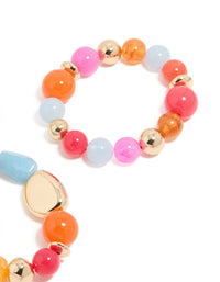 Highlighting acrylic beaded stretch bracelets with orange, pink, light blue, and gold accents in 2-pack close up view - link has visual effect only