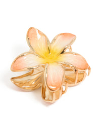 Showcasing a floral enamel peach and yellow frangipani claw clip in gold front view - link has visual effect only