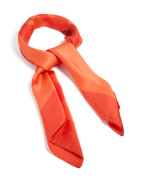 Showcasing an orange fabric scarf with double hibiscus floral print in coral, tomato, and dark orange tones, side view - link has visual effect only