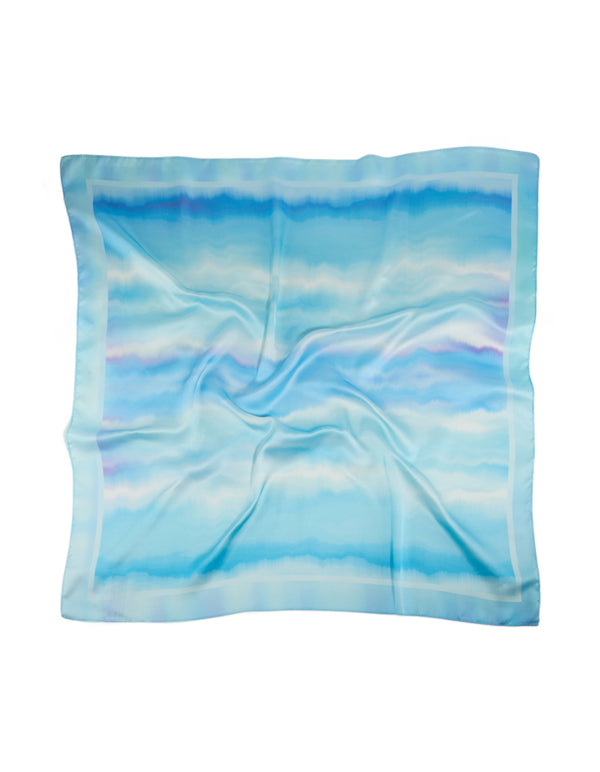 Discover a tie-dye striped fabric scarf in sky blue, powder blue, light blue, and royal blue shades front view
