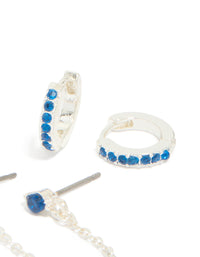 Crafted from silver blue cubic zirconia chain flower and huggie earrings 3-pack with floral elements close up view - link has visual effect only