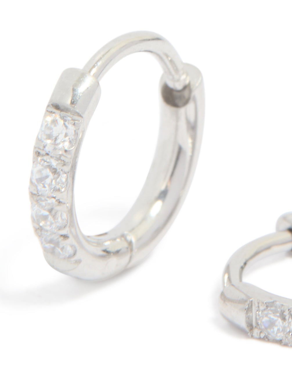 Featuring kids surgical steel sleeper earrings with cubic zirconia in silver close up view