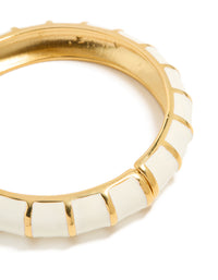 Close up view of waterproof ribbed bangle in gold plated stainless steel with white enamel close up view - link has visual effect only
