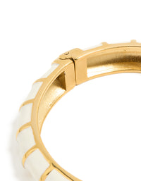 Waterproof ribbed bangle in gold plated stainless steel with white enamel closure detail view - link has visual effect only