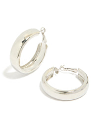 Showcasing chubby flat hoop earrings in silver with chunky styling and closure front view - link has visual effect only