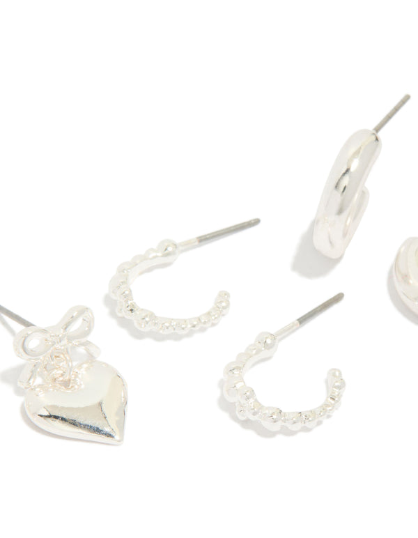 Discover chunky silver bow heart bubble stud and hoop earrings 3-pack close up view