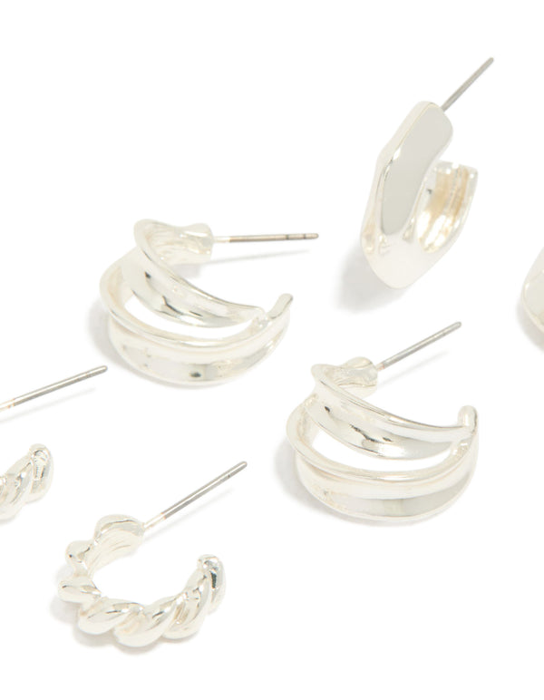 Featuring silver chubby and textured huggie earrings in a 3-pack close up view