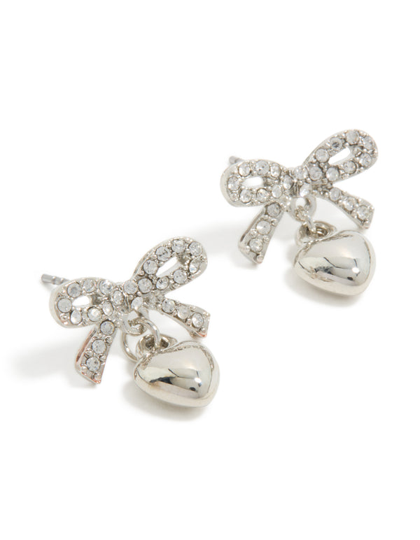Elegant stud earrings featuring a bow and heart charm design in silver, front view