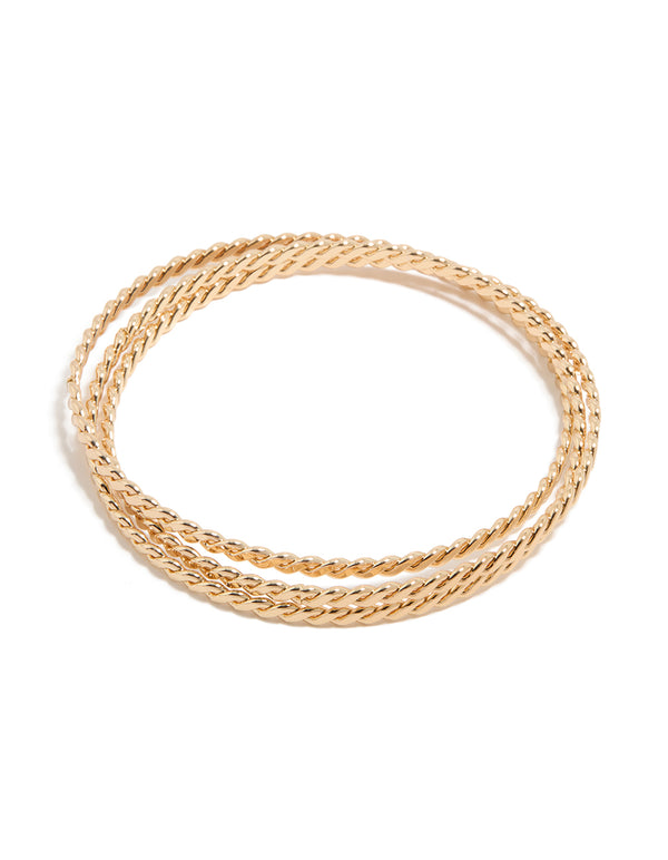 Showcasing a twisted Russian bangle in gold front view