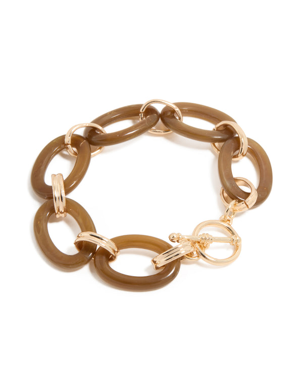 Showcasing a statement bracelet with bar detailing in gold and tan, featuring a T-bar toggle closure front view
