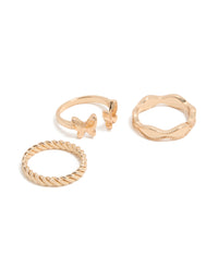 Showcasing a gold butterfly and twisted rings 3-pack front view - link has visual effect only