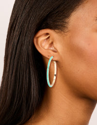 Showcasing large thin hoop earrings with aqua beads in turquoise and gold on ear view - link has visual effect only