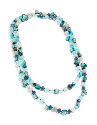 Designed with irregular double layered statement styling, featuring beads and ocean motifs in turquoise, navy, pale turquoise, and teal front view - link has visual effect only
