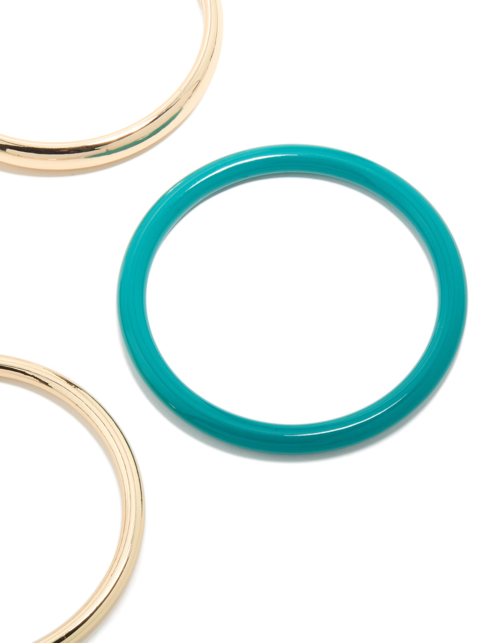Crafted from acrylic, this gold, brown and blue 4-pack bangle set close up view
