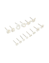 Showcasing a silver and diamante teardrop earrings 7-pack featuring butterfly, ball, and floral accents with clear stone details and stud closure front view - link has visual effect only