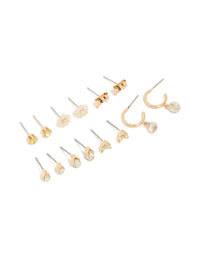 Showcasing a gold flower and bow earrings 7-pack in stud and hoop closures front view - link has visual effect only