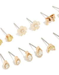 Featuring gold flower and bow earrings 7-pack in stud and hoop closures close up view - link has visual effect only