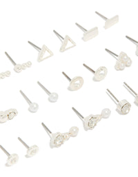 Explore this 12-pack of stud earrings with floral, triangle and pearl accents in silver and white close up view - link has visual effect only