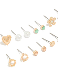 Elegant set of stud earrings in an 8-pack featuring heart, pearl, and floral designs with gold finish close up view - link has visual effect only