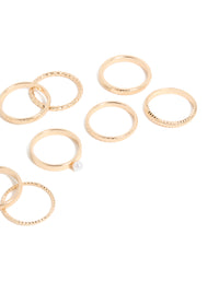 Crafted from gold with pearl embellishments, this simple stackable statement ring 10-pack highlights textured band craftsmanship side view - link has visual effect only