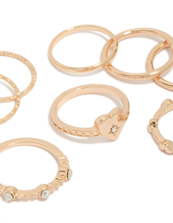 Presenting gold heart and diamante band rings 8-pack close up view