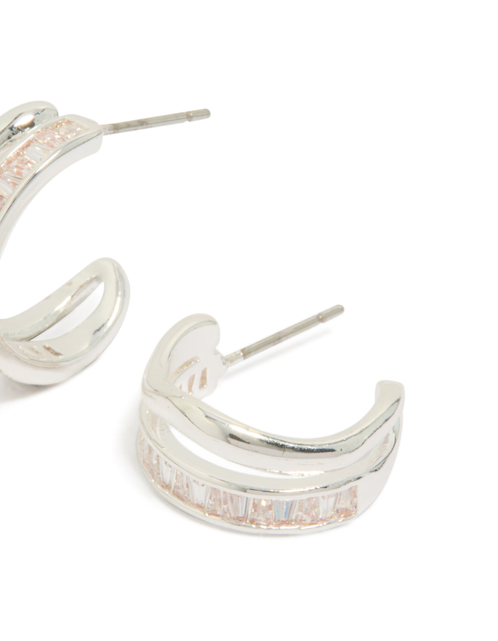 Displaying statement hoop earrings in silver plated featuring cubic zirconia baguette cut stones post detail view