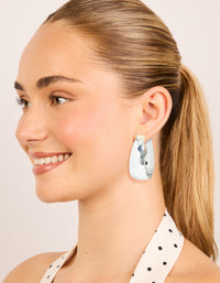 Highlighting silver plated smooth thick hoop earrings with closure on model view - link has visual effect only
