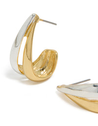 Crafted from mixed metal plated materials, these layered small hoop earrings showcase gold and silver close up view - link has visual effect only