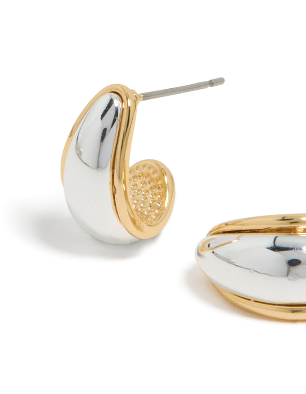 Highlighting small teardrop drop earrings crafted from mixed metal with gold plated and silver plated finishes close up view