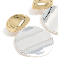 Crafted from mixed metal plated statement disc drop earrings in gold and silver close up view - link has visual effect only