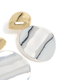 Showcasing mixed metal plated statement disc drop earrings in gold and silver post detail view - link has visual effect only
