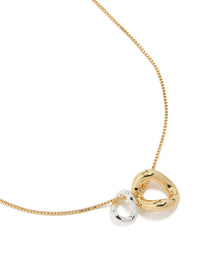 Expertly designed mixed metal small swirl pendant necklace in gold and silver plated materials close up view - link has visual effect only
