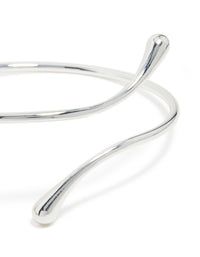Featuring a molten drop arm cuff in silver plated metal with statement design close up view - link has visual effect only