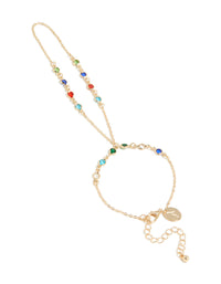 Showcasing a statement hand chain in multicolor diamantes featuring green, red, and blue stones front view - link has visual effect only