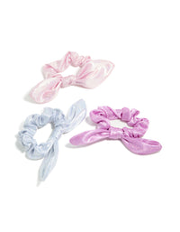 Discover kids pastel polyester bunny ear scrunchies in a 3-pack featuring glitter and solid print in lavender, light blue, and light pink front view - link has visual effect only