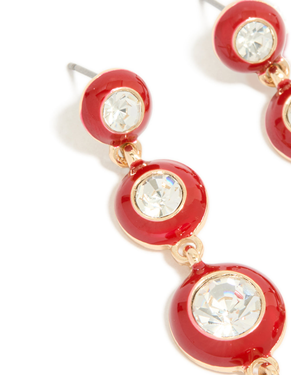 Elegant statement drop earrings with clear diamante and red enamel circle design in gold finish close up view
