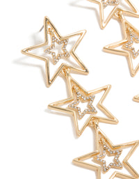 Discover these trio drop earrings featuring celestial star motifs in gold with white diamante embellishments close up view - link has visual effect only
