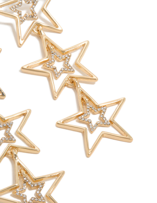 Detailed perspective of statement drop earrings with triple star design in gold and diamante accents post detail view