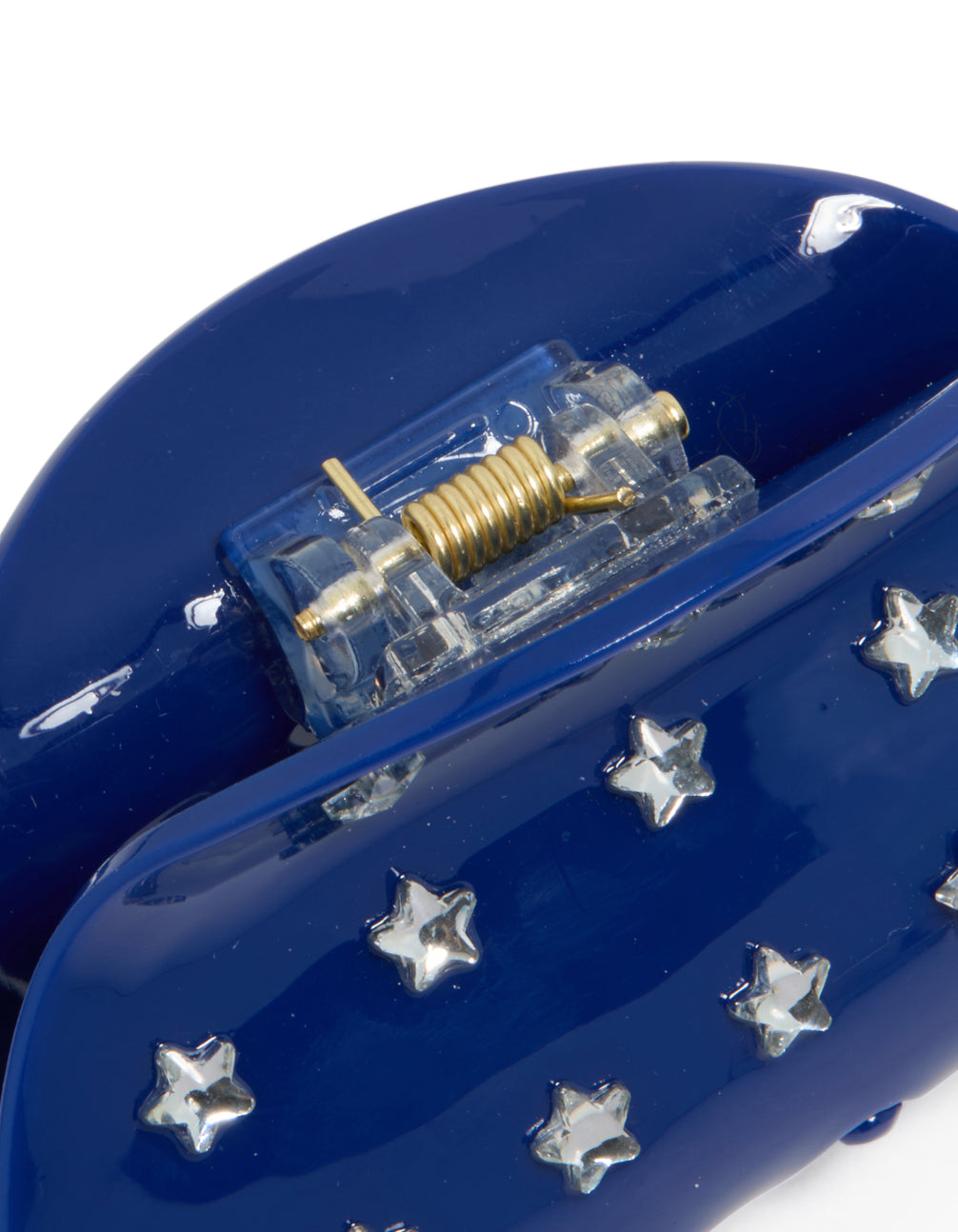 This blue cutie star hair claw features celestial design with in novelty print navy and silver detail view