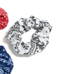 Featuring paisley print fabric scrunchies in a 3-pack with navy, white, coral, and light sky blue detail view - link has visual effect only