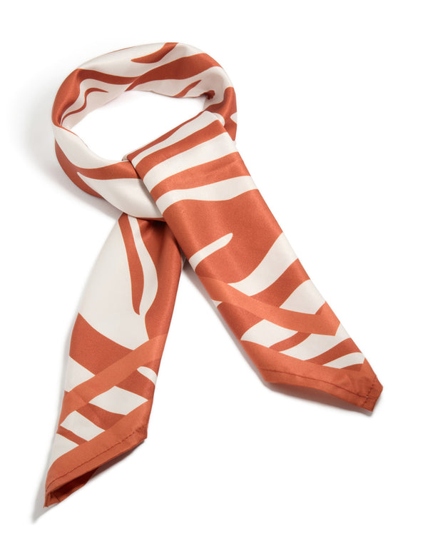 Beautifully crafted white and orange lined fabric scarf featuring abstract print in coral and ivory side view