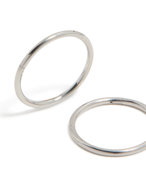 Featuring surgical steel thick sleeper hoop earrings with chunky style in silver and 12 MM size close up view