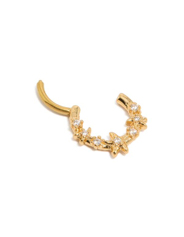 Showcasing a ocean starfish clicker ring in gold plated surgical steel with cubic zirconia accents and a dainty design detail view