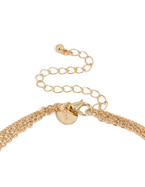 Beautiful statement necklace with beads, tassel, charm and disc in gold clasp detail view