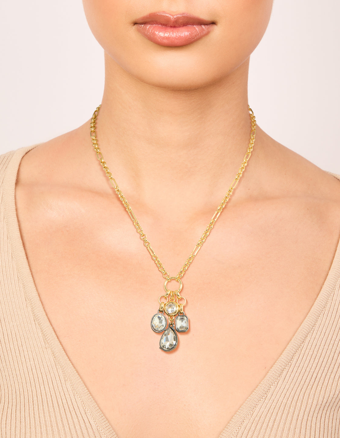 Featuring a mixed metal plated diamante cluster drop necklace with cubic zirconia in gold statement style on neck view