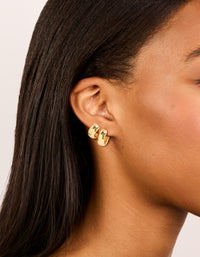 Featuring gold plated huggie earrings 2-pack on ear view - link has visual effect only